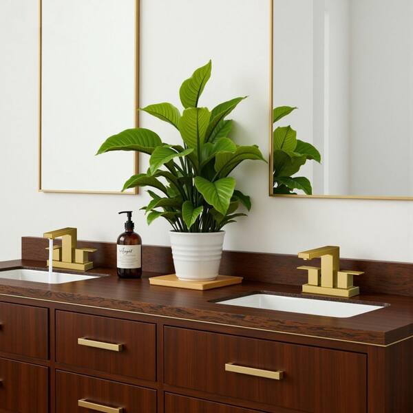 4 in. Centerset Double Handle Low Arc Bathroom Faucet with Pop-up Drain Kit included in Gold