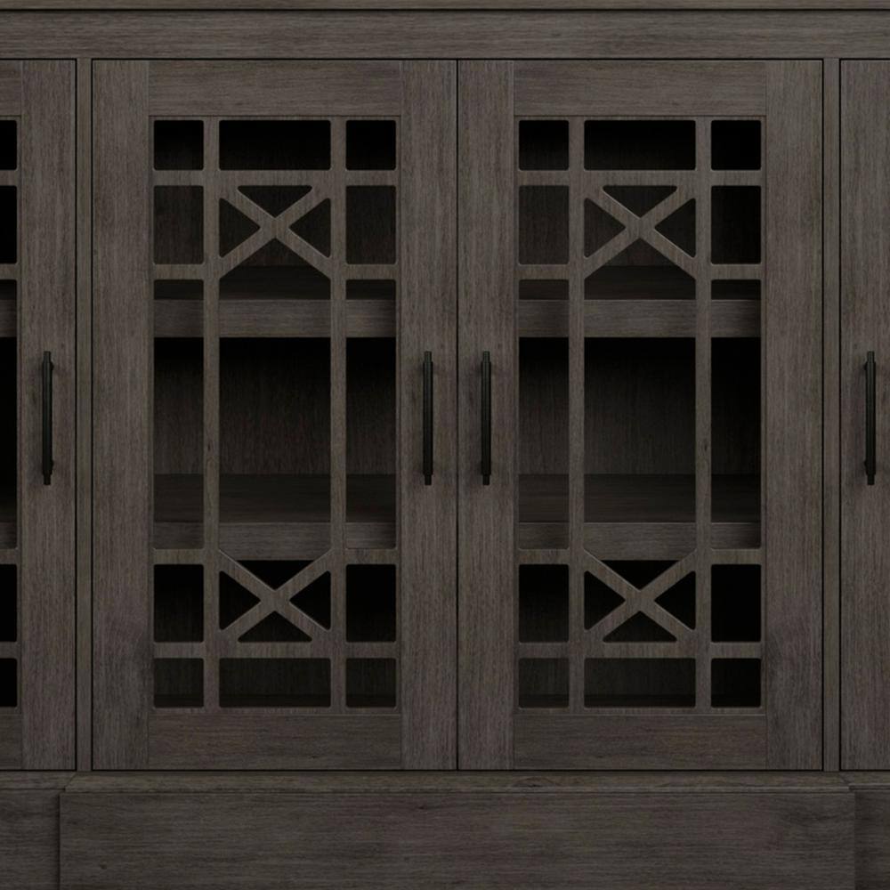 Close-up of two adjacent decorative glass doors on the gray sideboard.