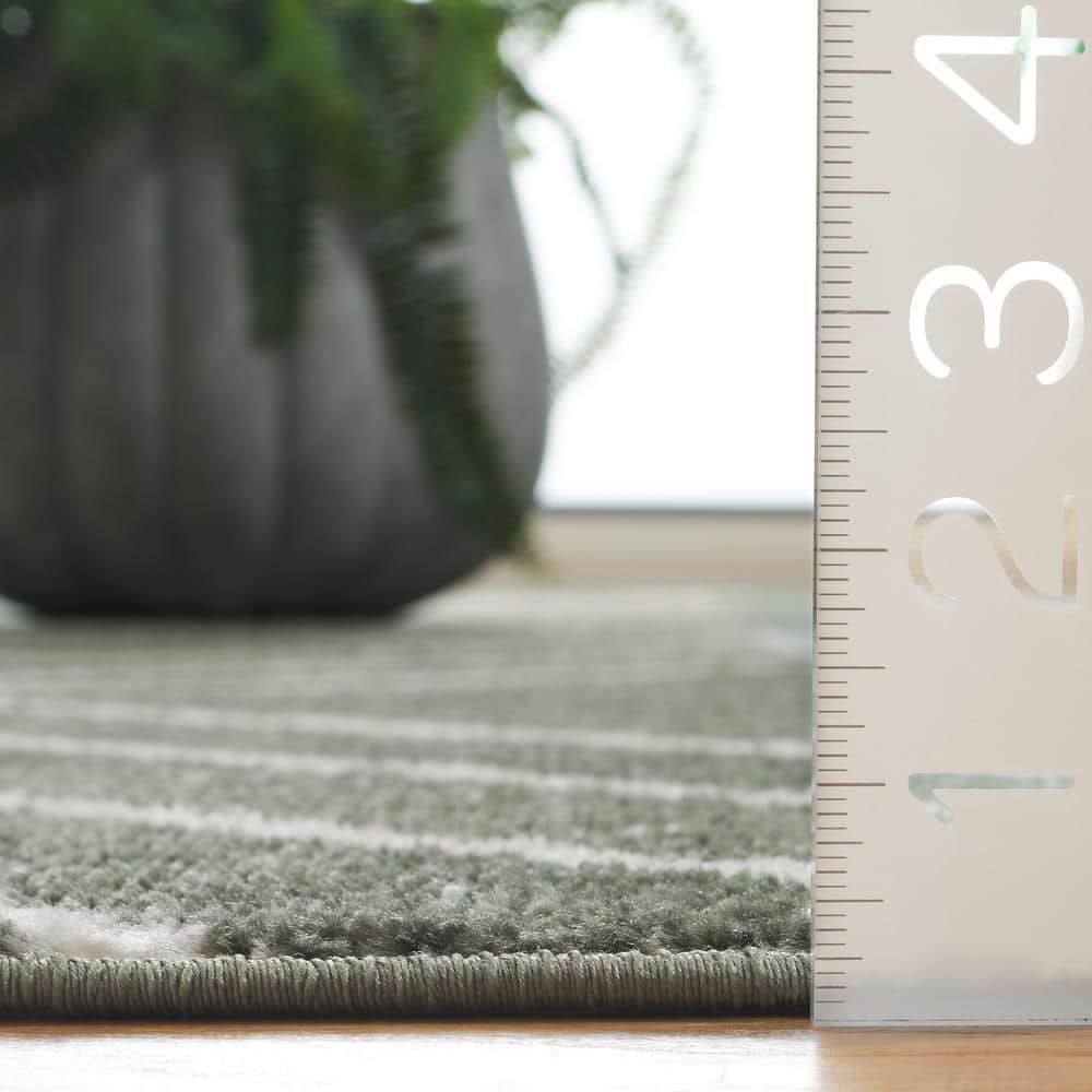 Ivory and Dark Green Geometric Synthetic Area Rug 5'1" x 7'6"