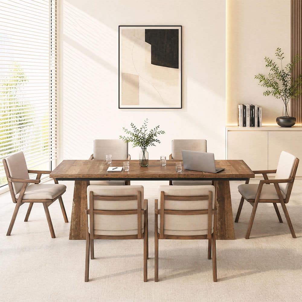 Wooden conference table with light beige chairs in a bright room.