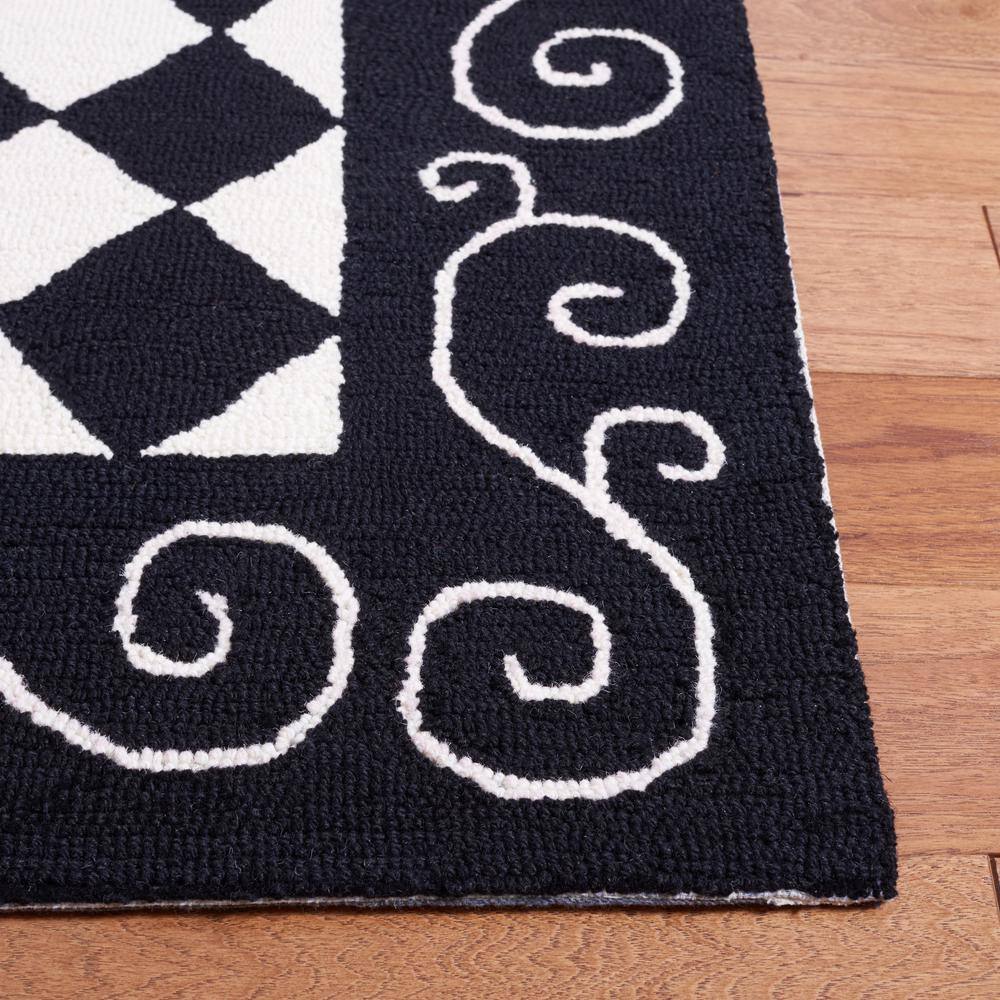 Handmade Black and Ivory Wool Floral Small Rug