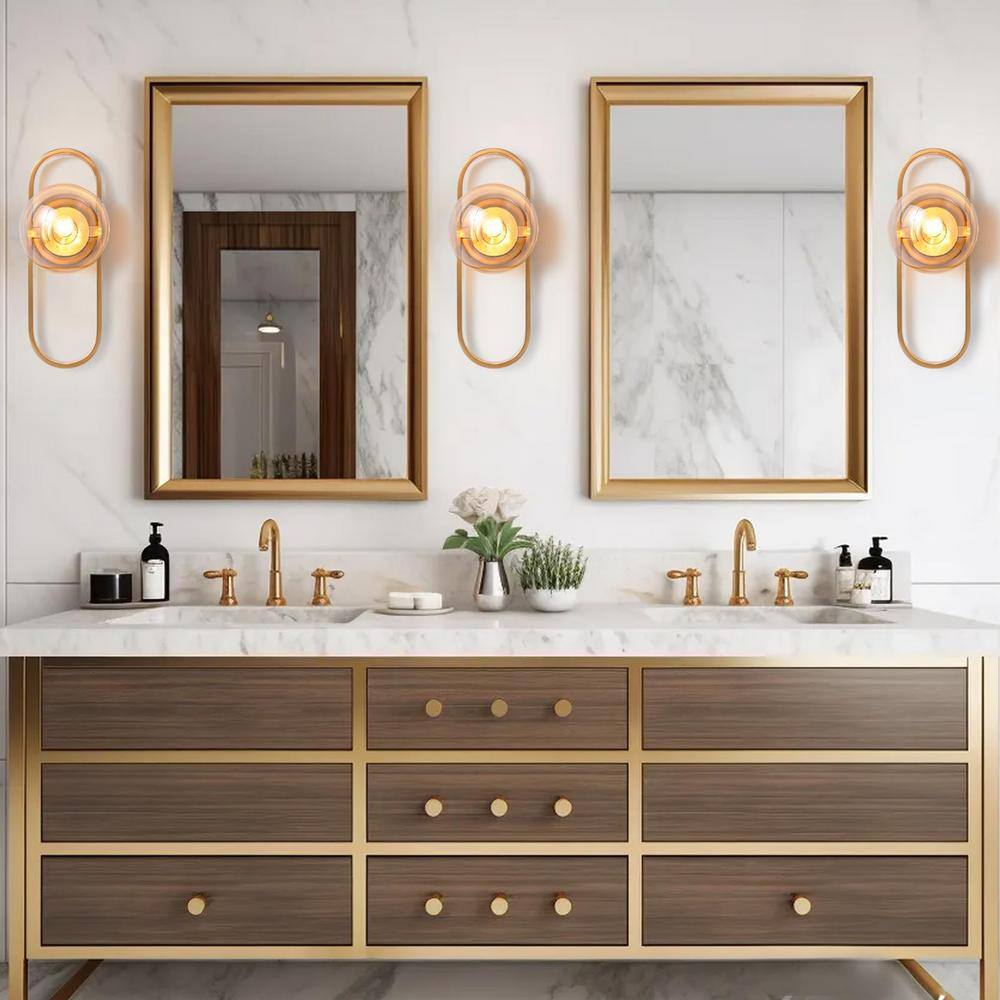 Modern Gold Metal Sconce with Clear Glass Globe Shade