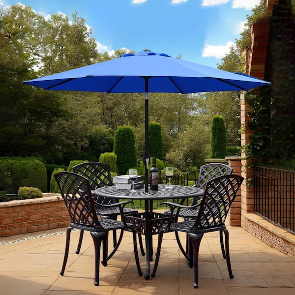 9 ft navy blue patio umbrella 8 rib Sunnyglade 9' Outdoor Table Umbrella with Ribs button tilt function that lets you adjust the shading angle flexibly At Home Navy Blue Outdoor