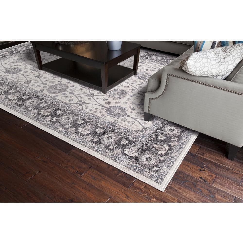 Ivory and Grey Tufted Synthetic 6'7" x 9'3" Stain-Resistant Area Rug