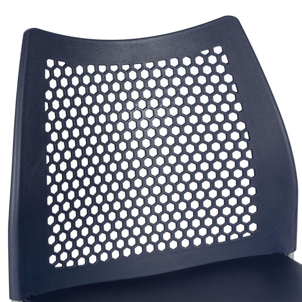 Close-up of the perforated backrest of a navy blue barstool.
