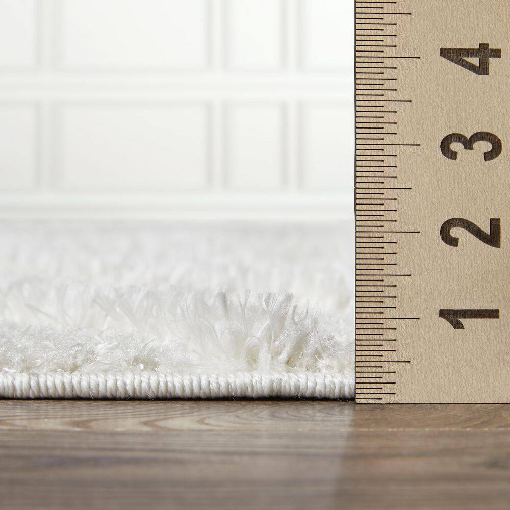 Cream 9' x 12' Stain-Resistant Synthetic Area Rug