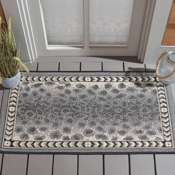 Courtyard Gray/Black 2 ft. x 4 ft. Border Cheetah Indoor/Outdoor Area Rug