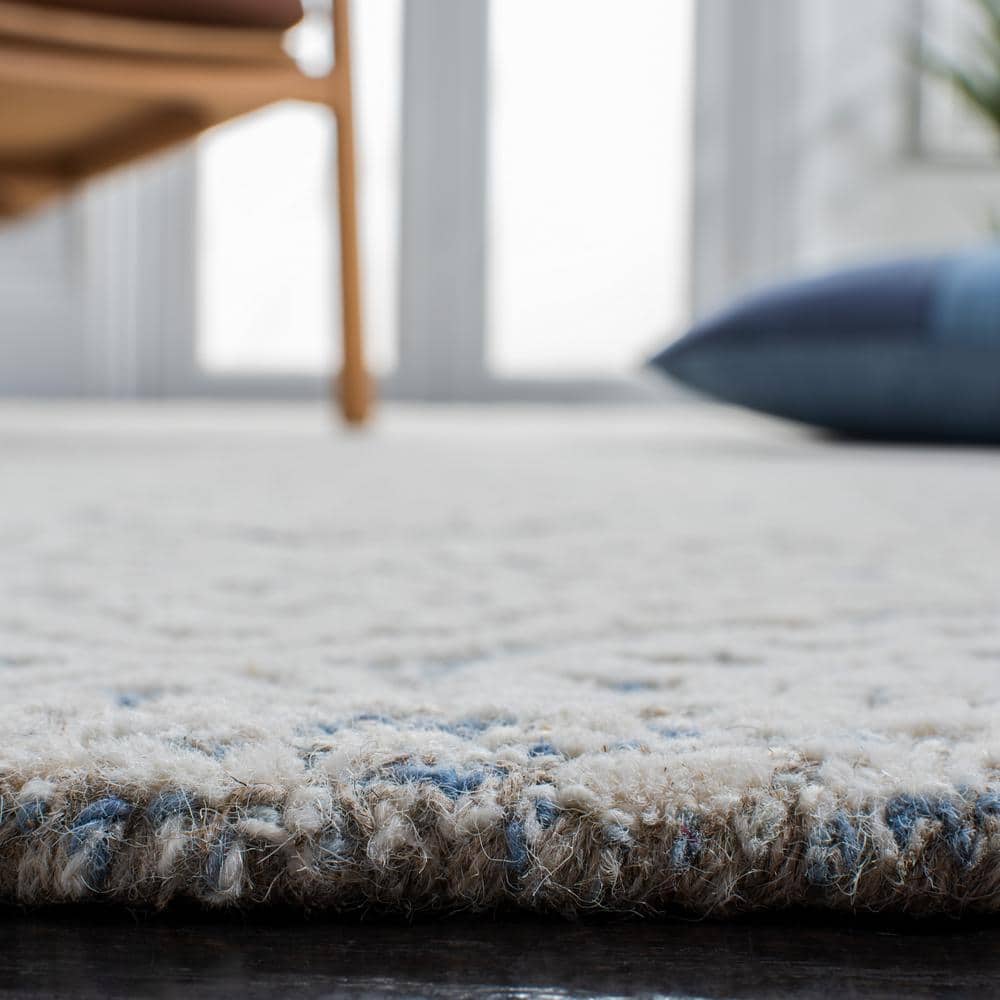 Light Blue and Ivory Floral Wool 8' x 10' Handmade Tufted Rug