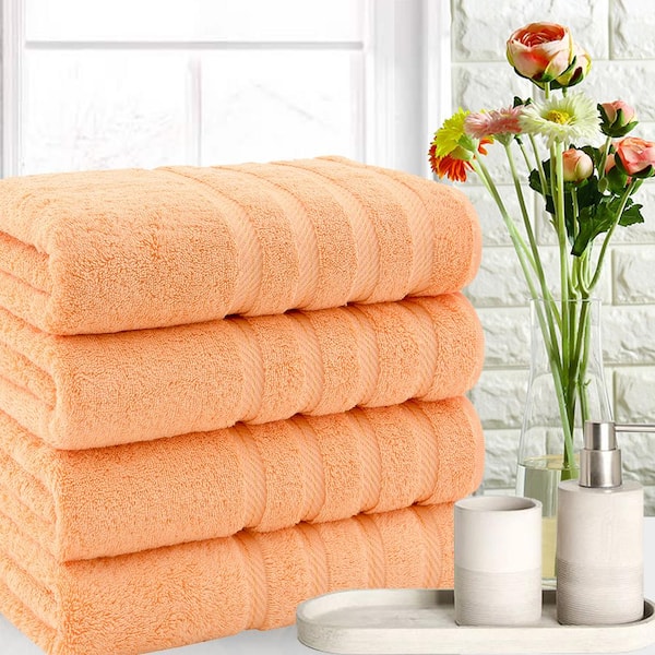 https://images.thdstatic.com/productImages/18ca41ea-dc85-404e-a4a1-f50f364e6299/svn/malibu-peach-american-soft-linen-bath-towels-edis4bathskye134-31_600.jpg