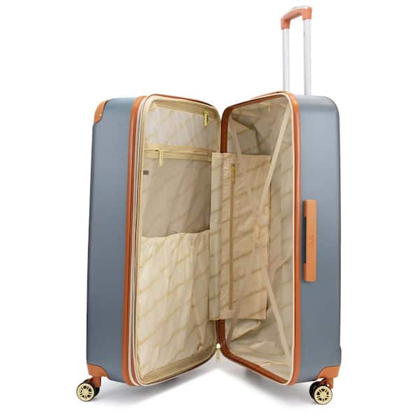 white suitcase with brown trim