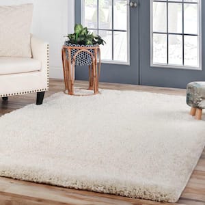 Berlin Ivory 5 ft. x 8 ft. Solid Plush Shag Indoor Area Rug