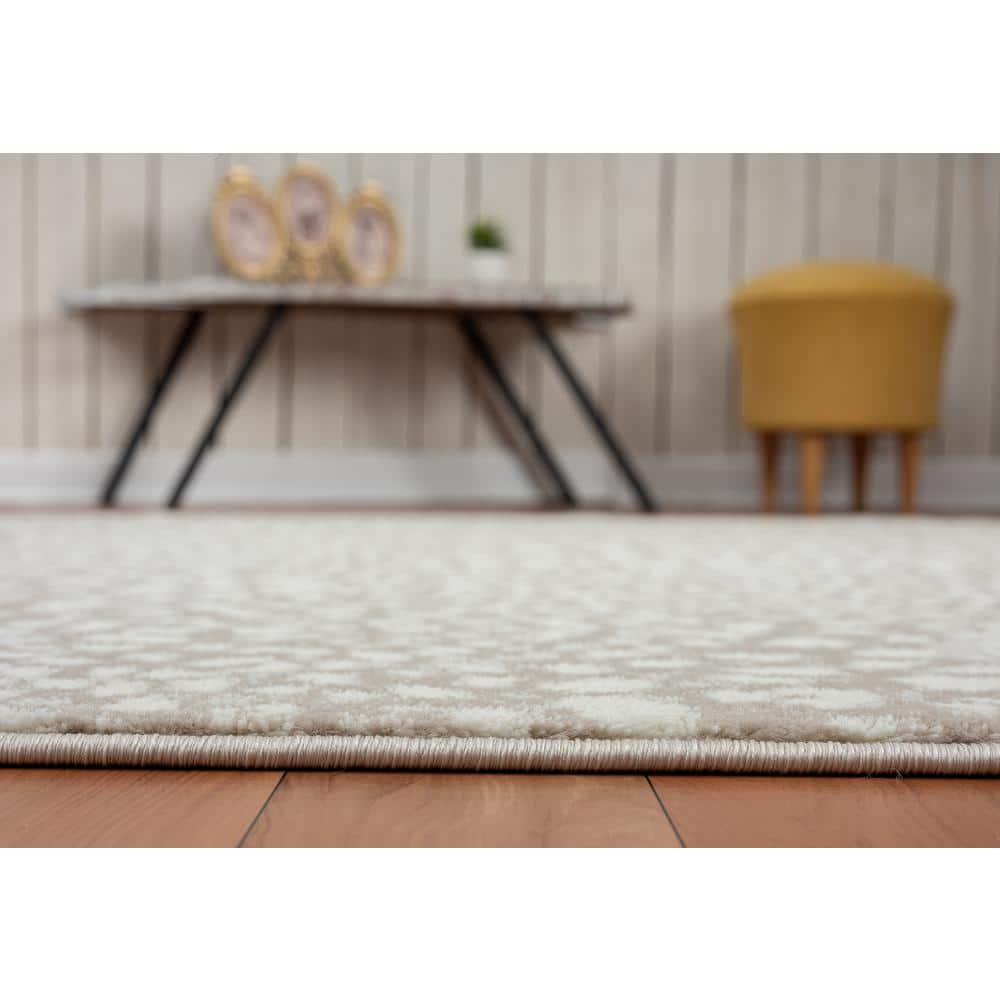 Ivory and Beige Cheetah Print 8' x 10' Synthetic Area Rug