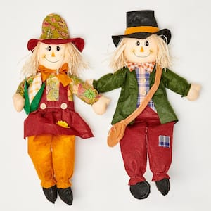 24 in. Sitting Boy and Girl Scarecrow with Sack or Corn (Set of 2)