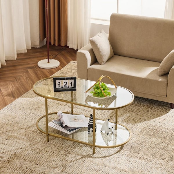 Karl home 38 in. Matte Gold Oval Glass Coffee Table