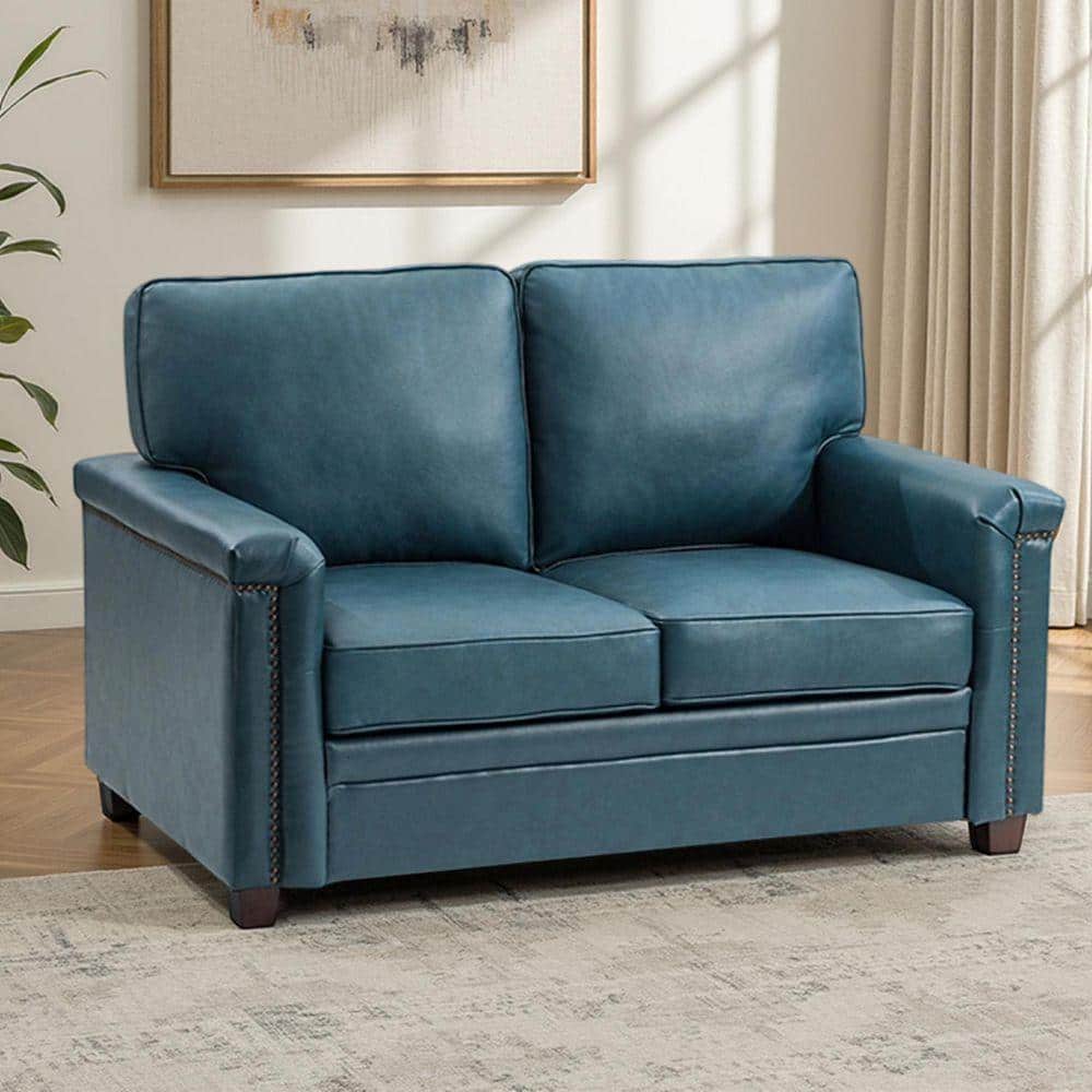 Turquoise leather two-seat sofa with rolled armrests and dark wooden legs.