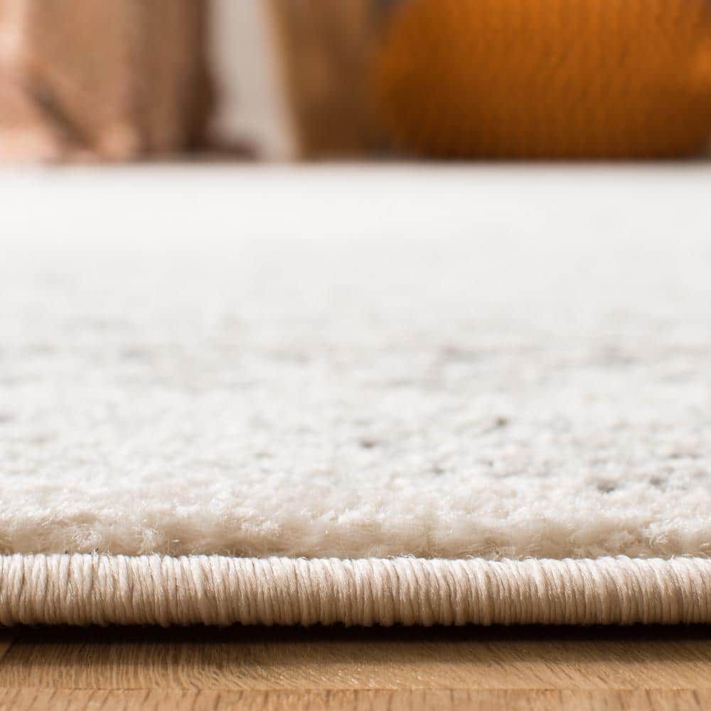 Ivory Boho-Chic Hand-Knotted Synthetic Area Rug