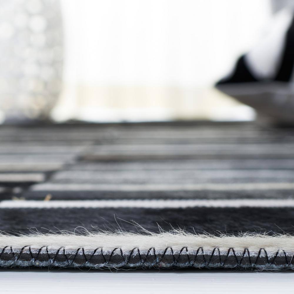 Hand-Knotted Black and Beige Geometric Cowhide Rug