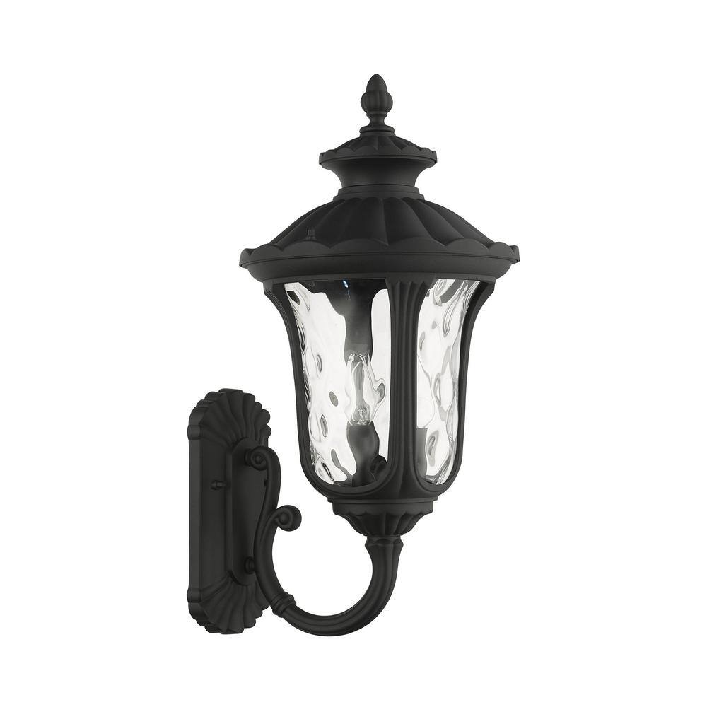Artisanal Textured Black 3-Light Outdoor Lantern Sconce with Clear Water Glass