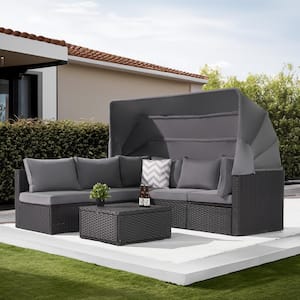 4-Piece Patio Rattan Daybed Set with Retractable Canopy, Gray Soft Cushions and Versatile Coffee Table