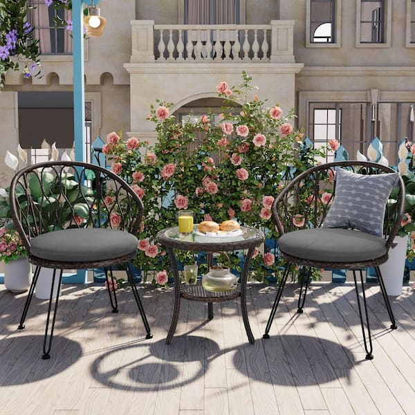 3-Piece Wicker Outdoor Bistro Set with Gray Cushions and A Glass Round Table