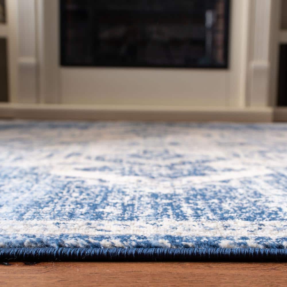 Ivory and Navy Classic Synthetic Round Rug, 6' x 9', Stain-Resistant