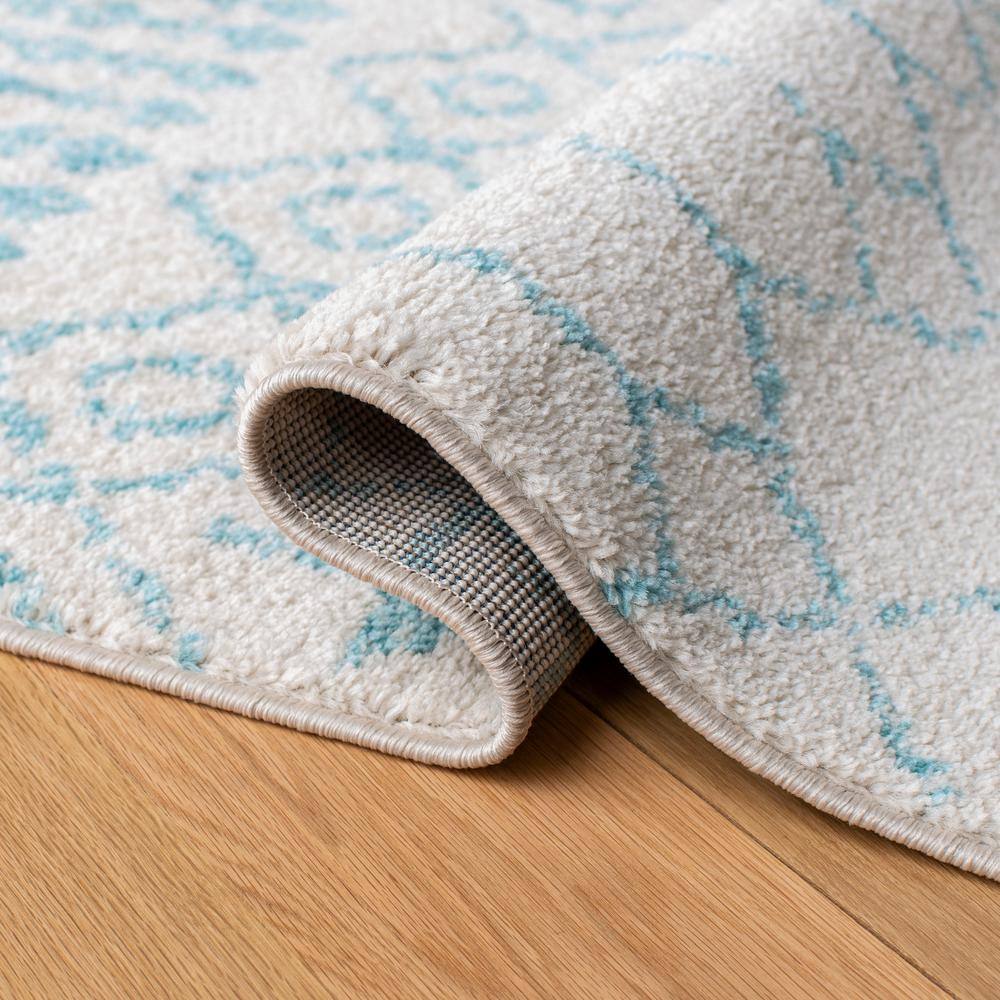 Ivory and Turquoise Moroccan Geometric 8' x 10' Area Rug