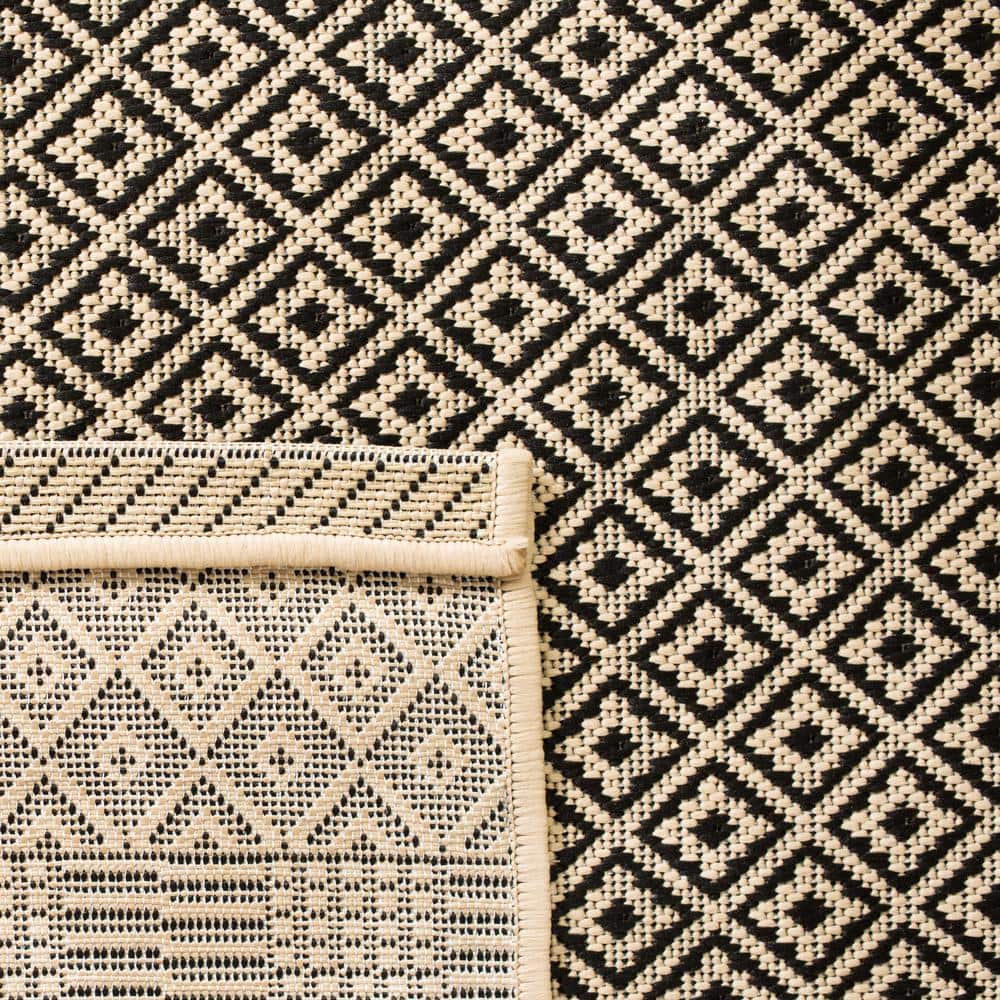 Beige and Black 9' x 12' Synthetic Flat Woven Reversible Rug