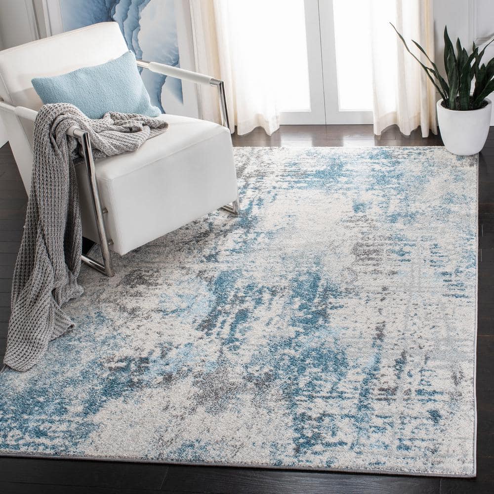 Ivory and Blue Abstract 9' x 12' Synthetic Area Rug