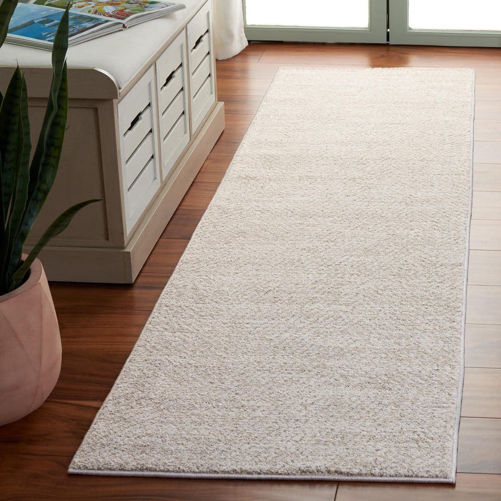 SAFAVIEH Northport 2 ft. x 8 ft. Ivory/Beige Distressed Solid Color ...