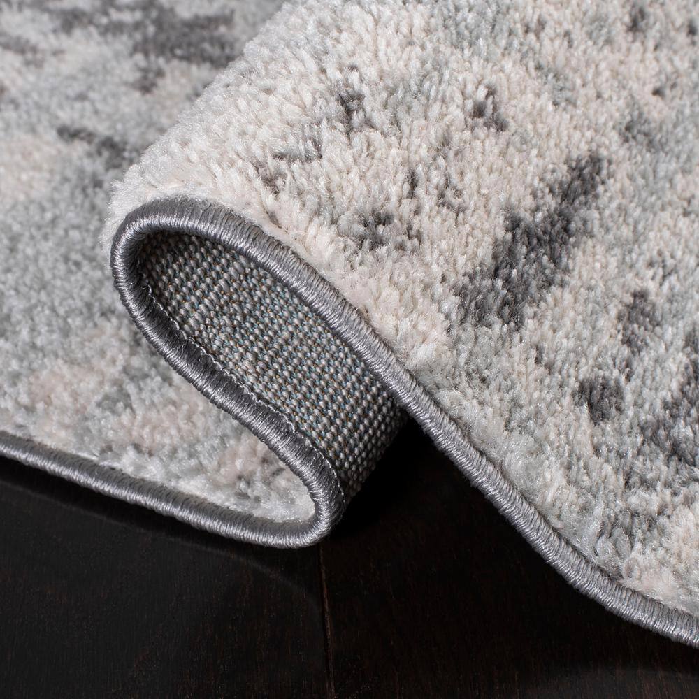 Ivory Abstract 4' x 6' Reversible Synthetic Area Rug
