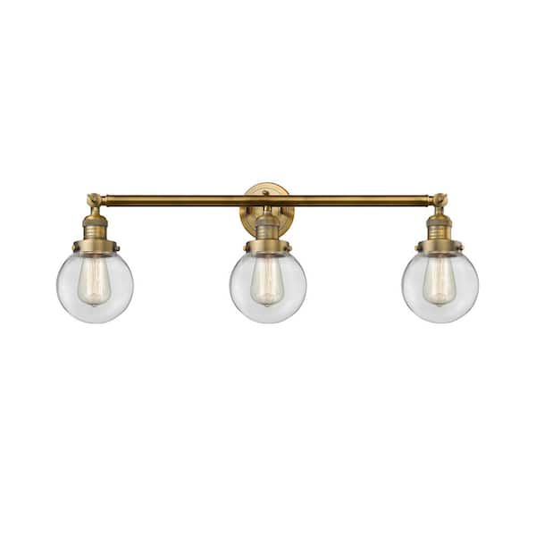 Innovations Beacon 30 in. 3-Light Brushed Brass Vanity Light with Clear Glass Shade