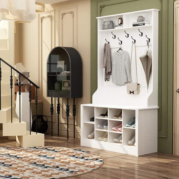 By removing the hanger rod and adding a cube storage bench, hooks and a  shelf, this tiny closet …