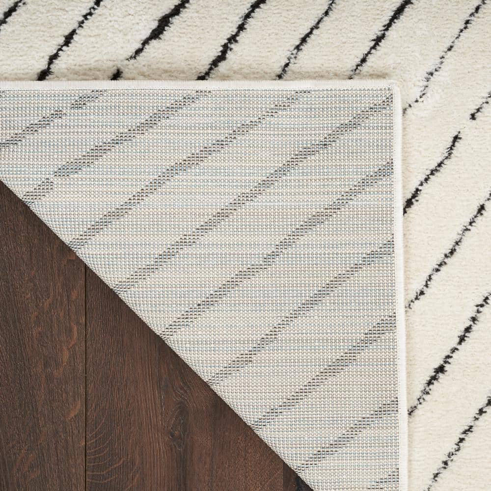 Ivory and Black Chevron Striped 5' x 7' Synthetic Area Rug