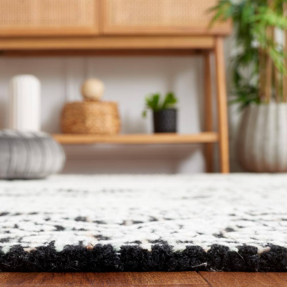 Handmade Black Wool 6' x 9' Tufted Area Rug