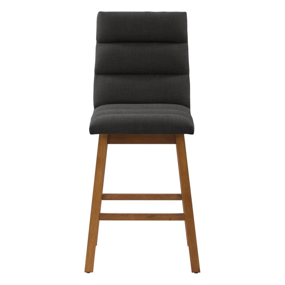 Front view of a dark grey channel tufted barstool.