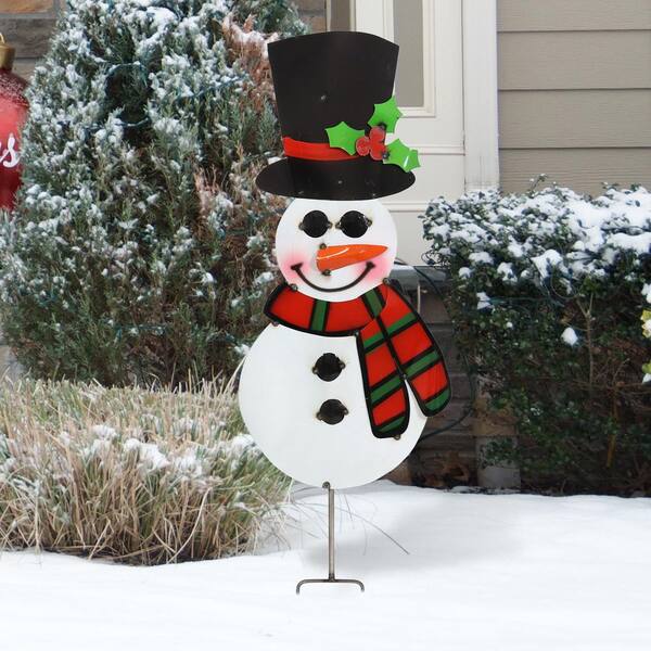 building a snowman stock photos - OFFSET