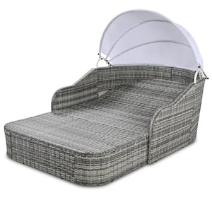 Gray Wicker Outdoor Chaise Lounge with Blue Cushion and Adjustable Canopy