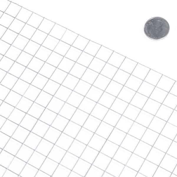A piece of white plastic mesh with large square meshes on the gray  background.