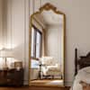 XRAMFY Antique Gold 28 in. W x 69 in. H Arched PU Frame with Ornate Carved Decoration Full Length Mirror Floor Mirror FMPUAC052869GD