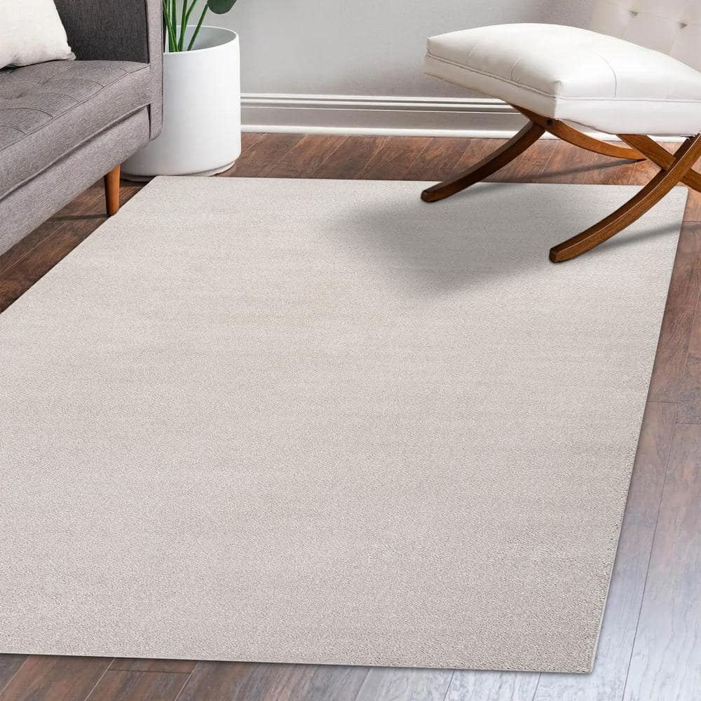 Ivory Solid Synthetic 10' x 14' Reversible Area Rug