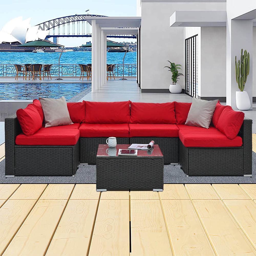 7-Piece Gray Wicker Patio Conversation Set with Red Cushions and Coffee Tab