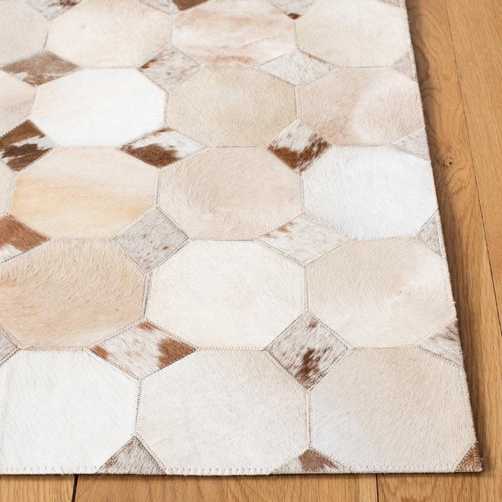 Hand-Stitched Ivory and Brown Geometric Cowhide Rug - 2'3" x 9'