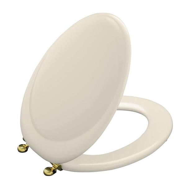 KOHLER Revival Elongated Closed-front Toilet Seat with New England Brass Hinge in Almond-DISCONTINUED