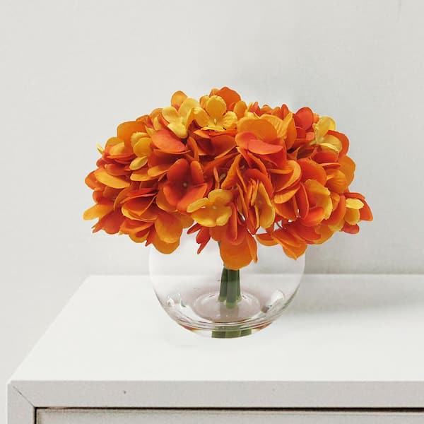 LIVING LUXURY 7 in. Orange Artificial Hydrangea Flower Arrangement in Round Glass Vase