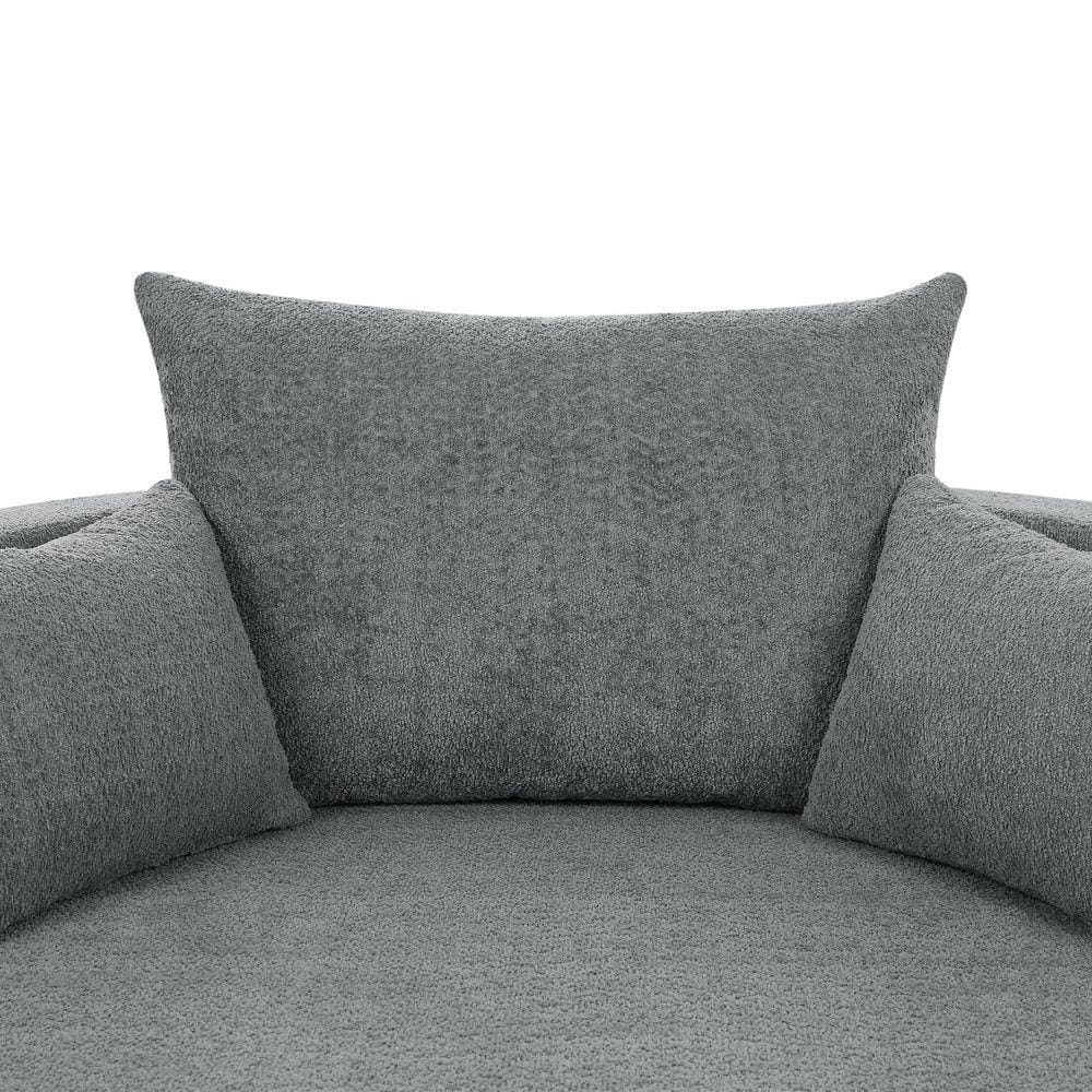 Close-up of the seat and pillows of a gray chenille barrel chair.