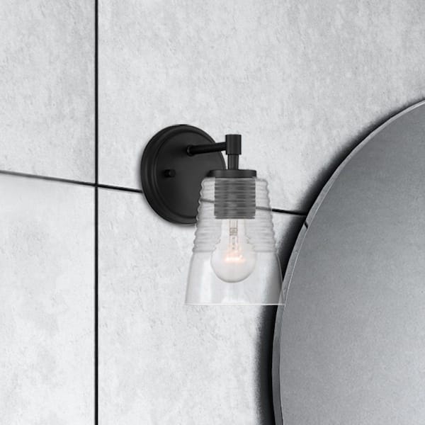 Designers Fountain Ingo 5 in. 1-Light Matte Black Transitional Wall Sconce with Clear Ribbed Glass Shade