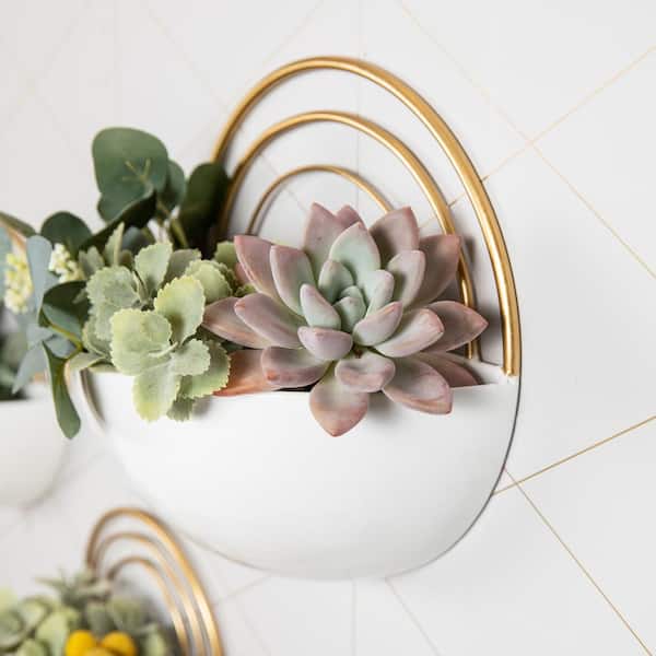 https://images.thdstatic.com/productImages/1bc50205-554f-483e-9c84-97ecbba3e108/svn/white-gold-danya-b-wall-planters-fhb21655-1f_600.jpg