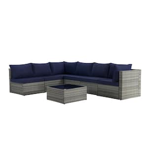 7-Piece Wicker Outdoor Patio Conversation Set with Dark Blue Cushions and Tempered Glass Coffee Table