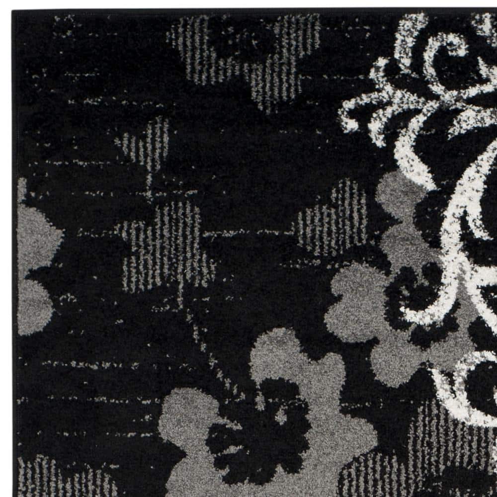 Chic Lodge 6' x 9' Hand-Knotted Black/Silver Synthetic Area Rug