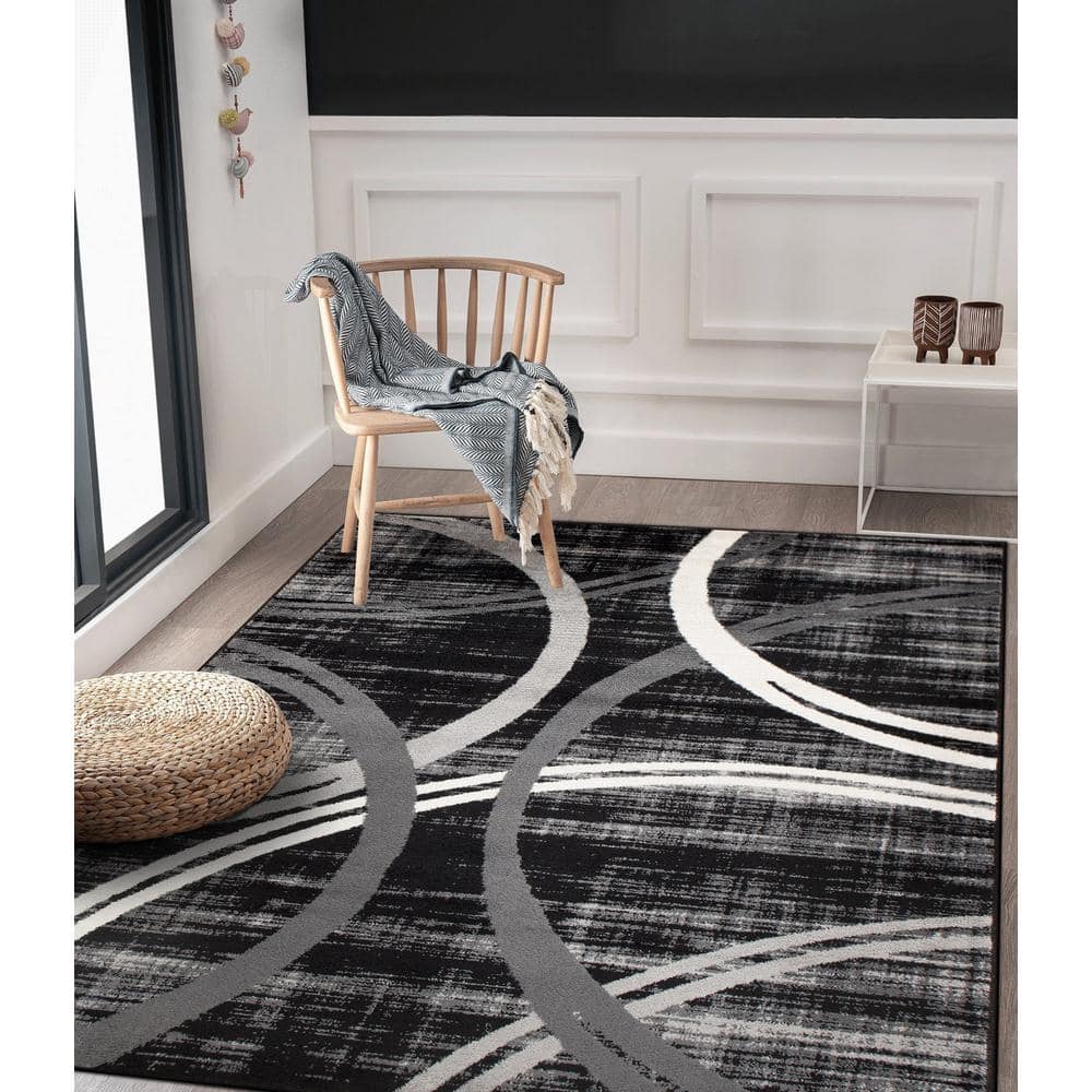 Modern Black and Gray Abstract Oval Area Rug, 5' x 7'